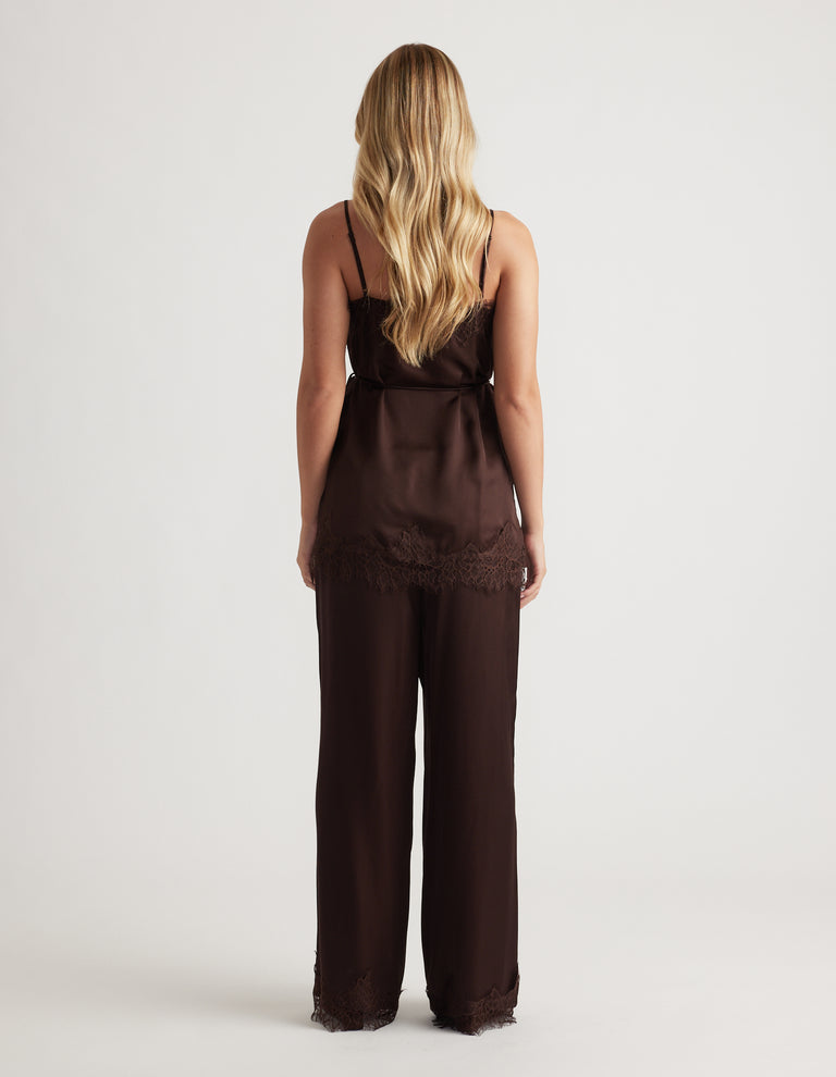 Back view of a rich mocha silky camisole with delicate lace trim paired with matching wide-leg pants