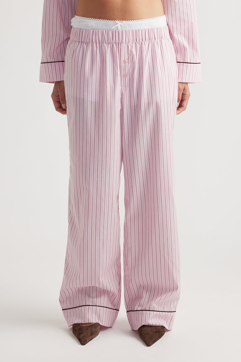 Front view of soft pink woven wide leg pants with vertical stripes and elastic waistband for relaxed comfort fit