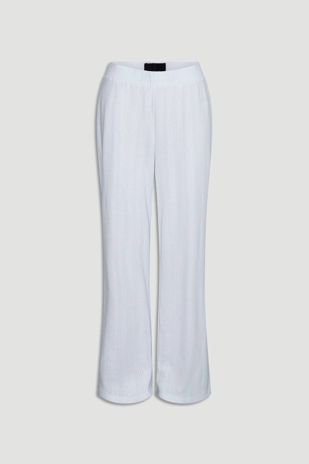 Soft white wide-leg pants crafted from lightweight pointelle knit fabric with a relaxed silhouette and elastic waist waistband