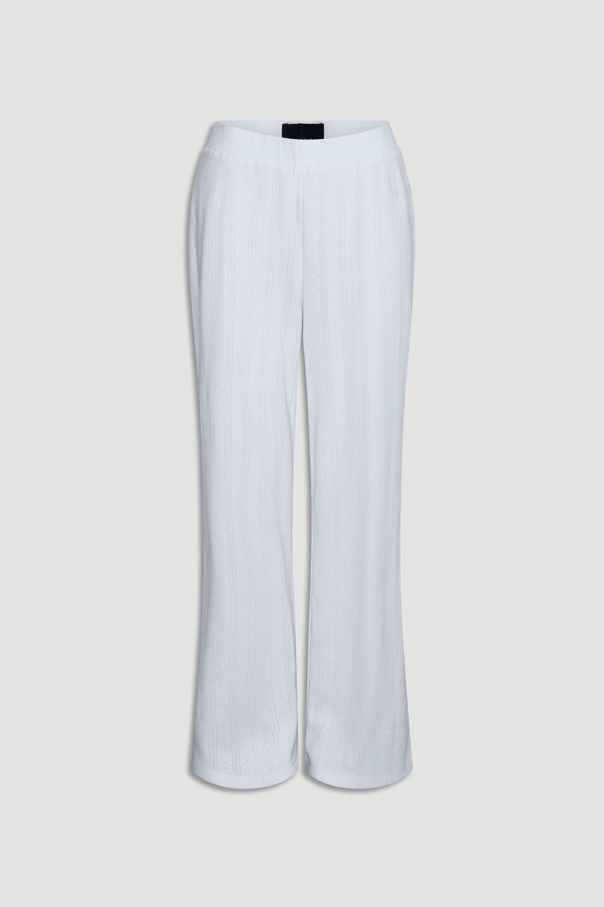 Soft white wide-leg pants crafted from lightweight pointelle knit fabric with a relaxed silhouette and elastic waist waistband
