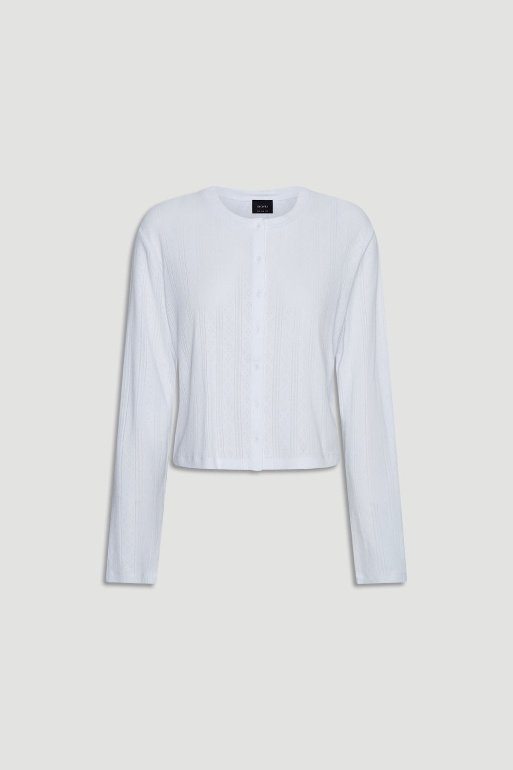 White lightweight pointelle knit long sleeve top with button front and relaxed fit for casual layering