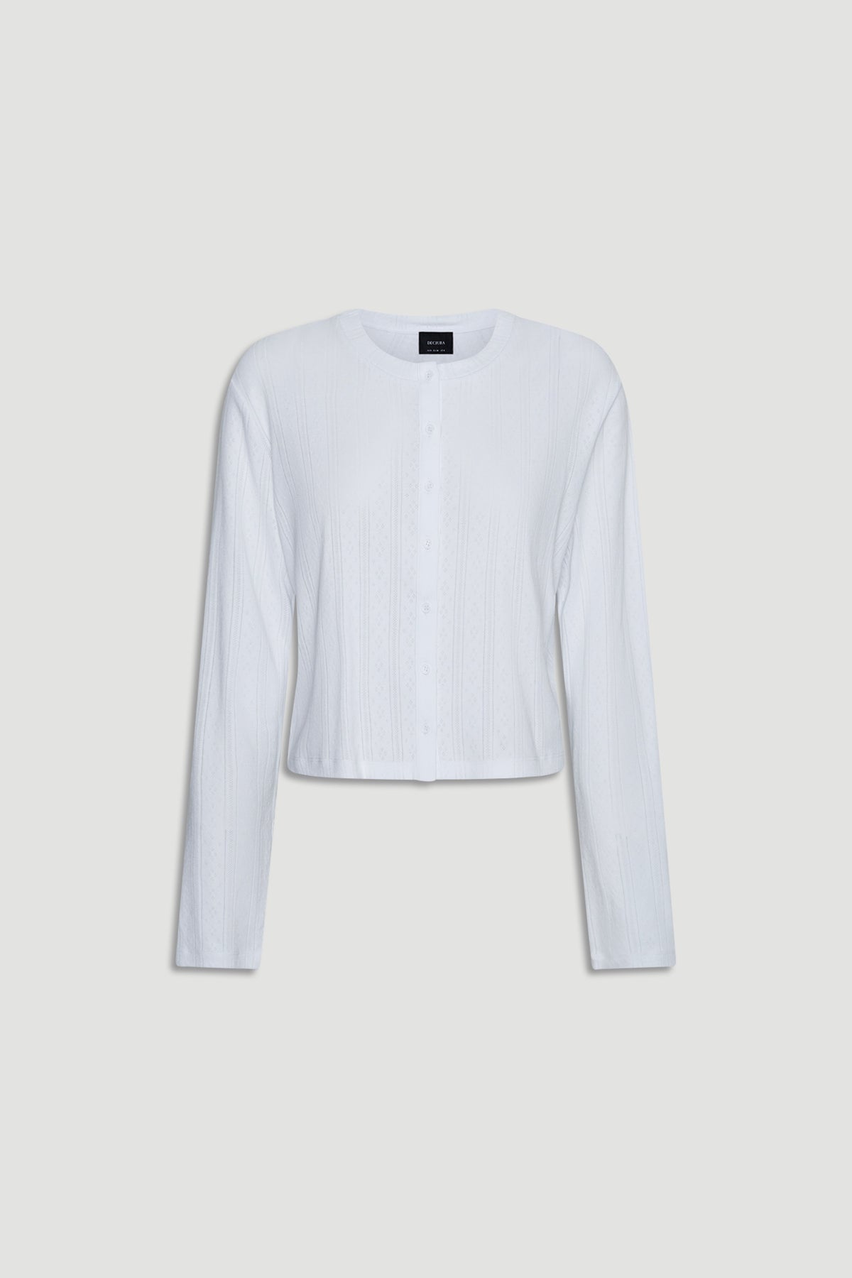 White lightweight pointelle knit long sleeve top with button front and relaxed fit for casual layering