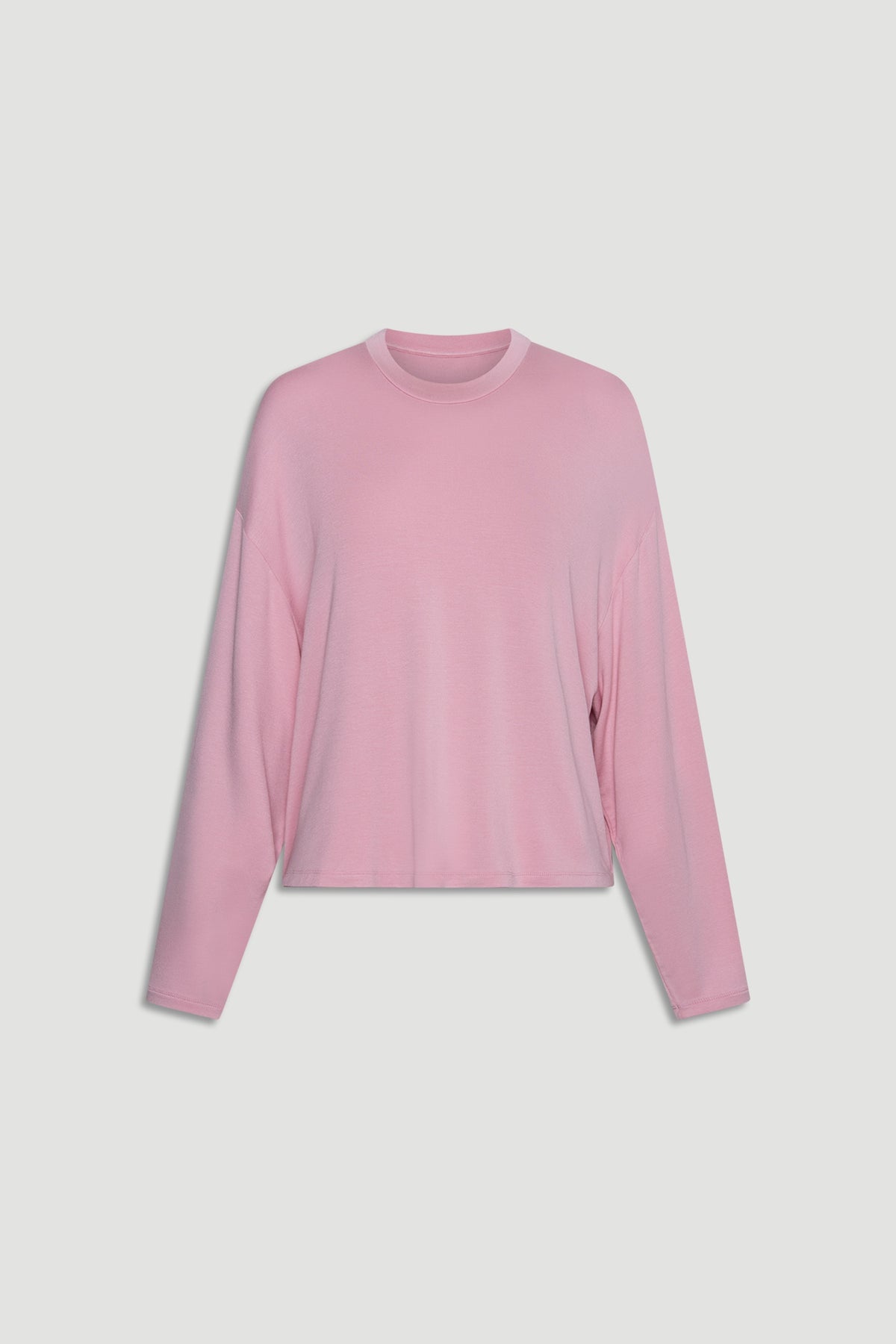 Soft pink long sleeve top in breathable jersey fabric with relaxed fit and casual crew neckline