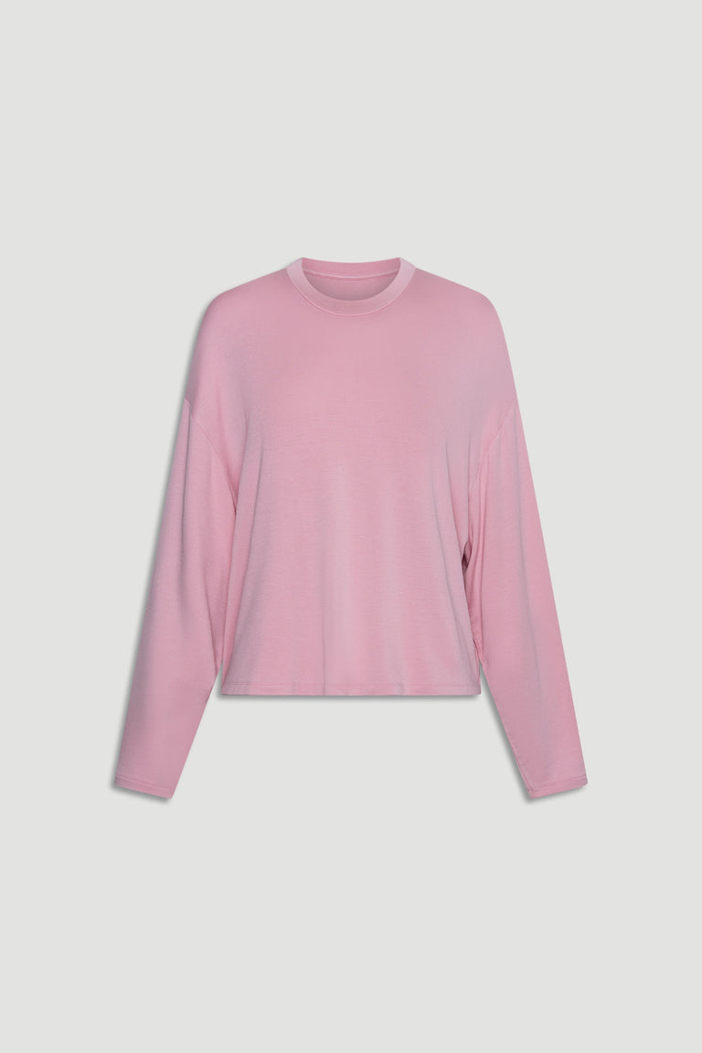 Soft pink long sleeve top in breathable jersey fabric with relaxed fit and casual crew neckline