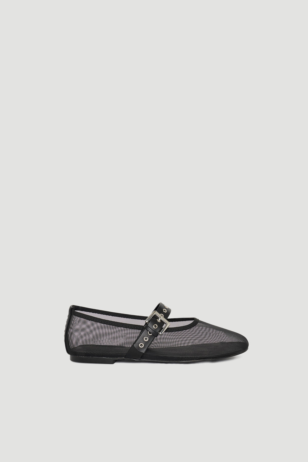 Black mesh ballet flat featuring a slim profile and adjustable buckle strap for a delicate, modern look