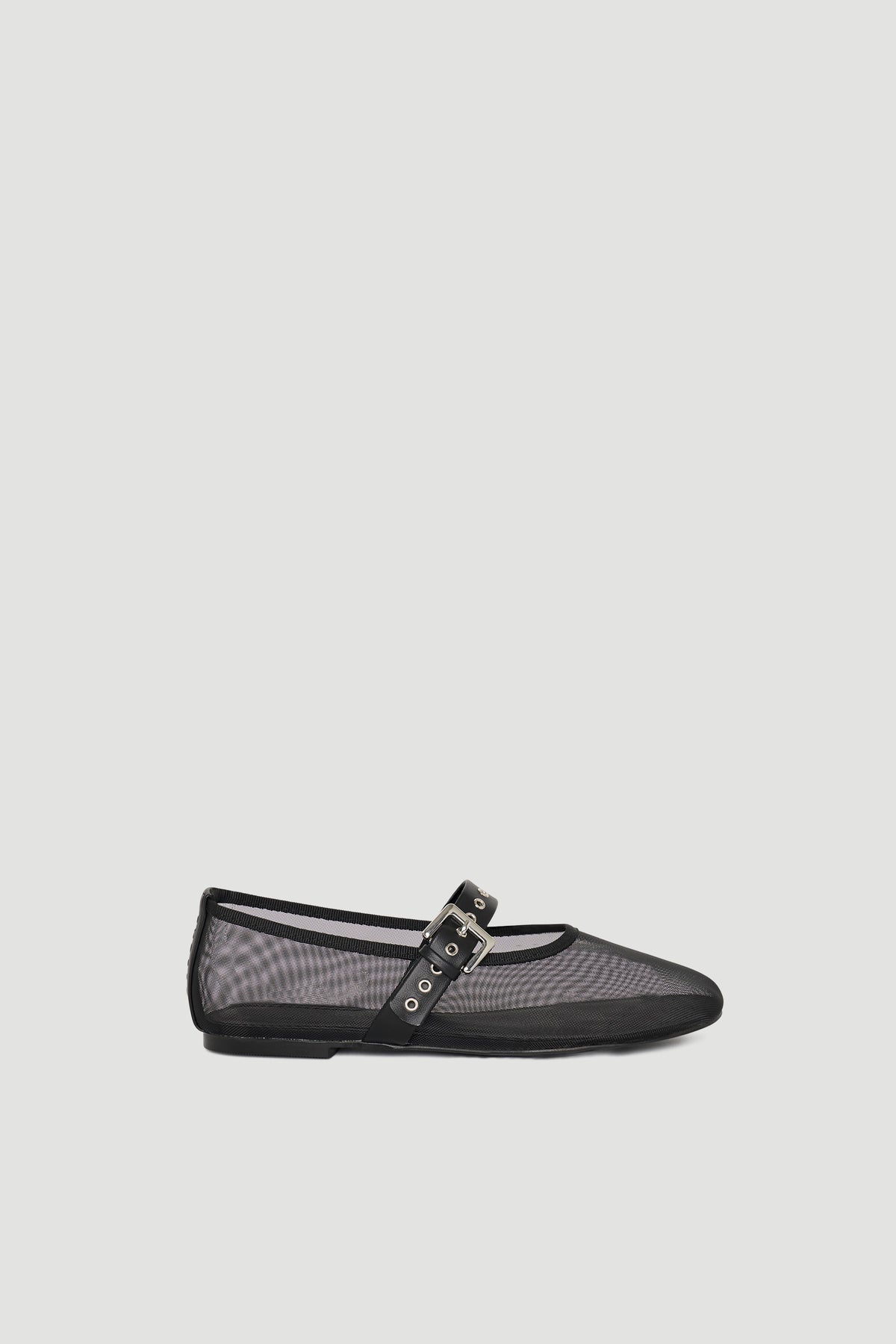 Black mesh ballet flat featuring a slim profile and adjustable buckle strap for a delicate, modern look