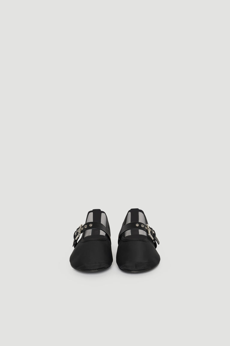 Pair of black ballet flats featuring mesh panels and buckle strap detailing for a stylish, modern look