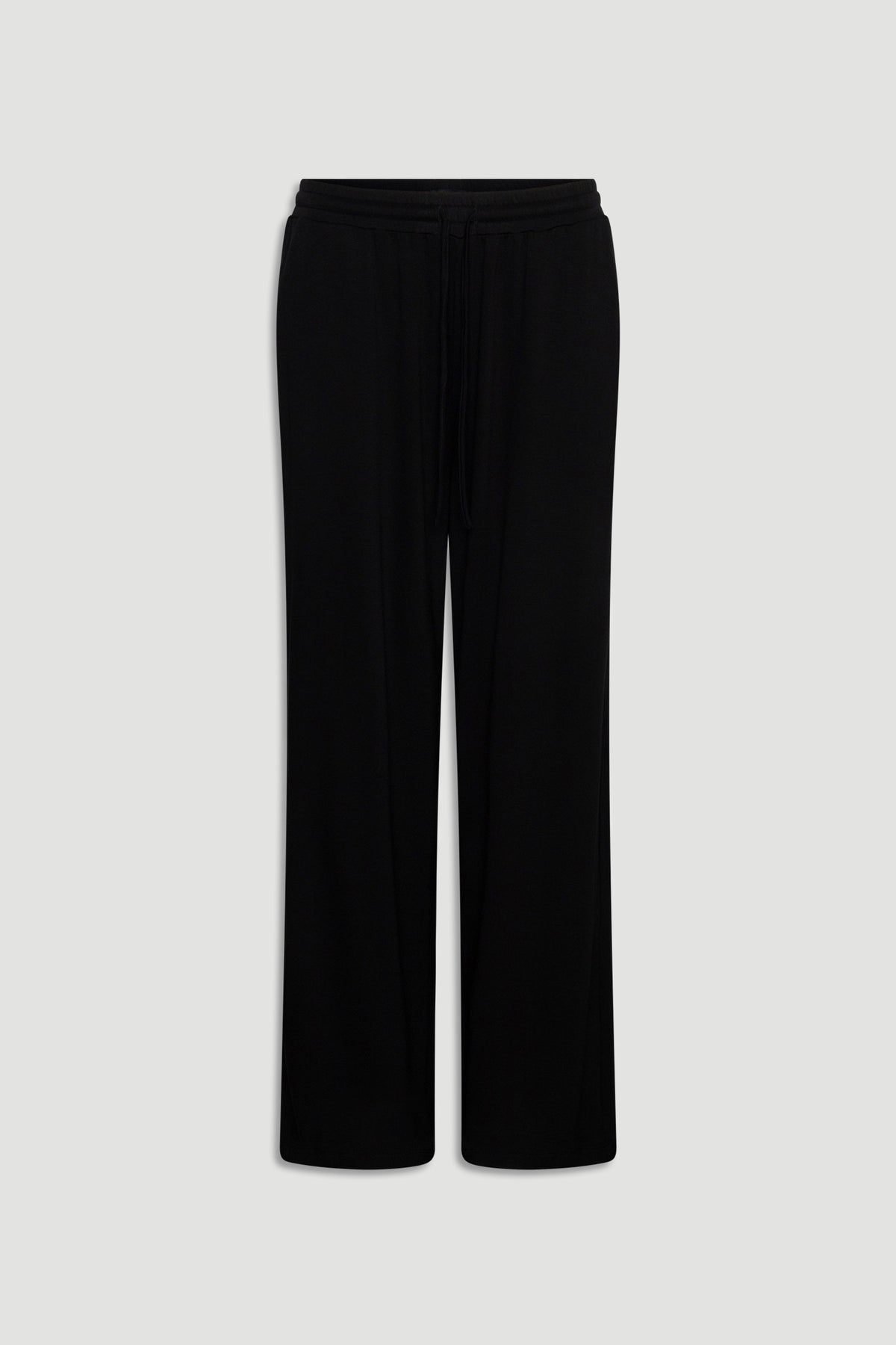 Black wide-leg lounge pants made from soft jersey fabric with an elastic waistband and drawstring detail