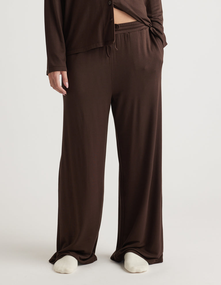 Relaxed wide-leg sleep pants in soft chocolate brown with an elastic waistband and smooth draping fabric
