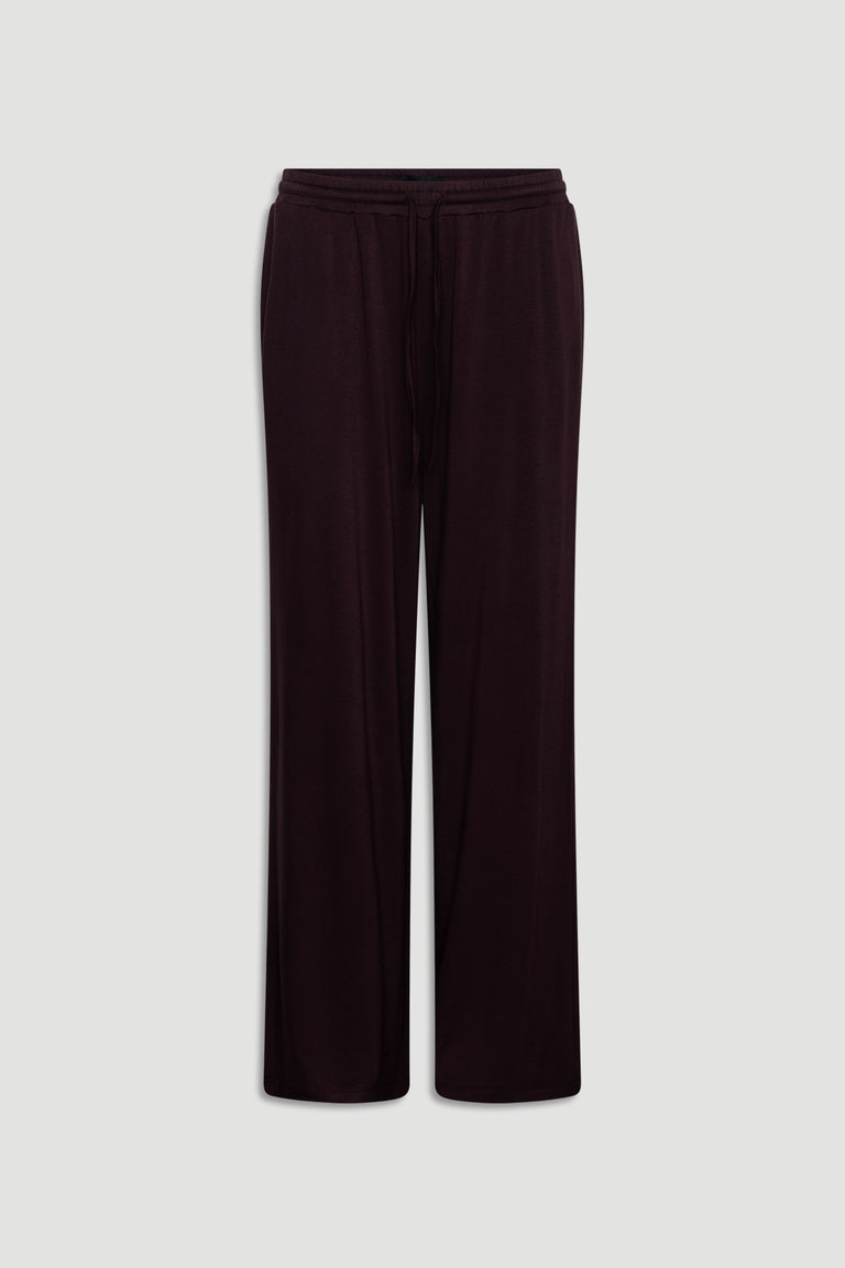 Wide leg sleep pants in deep burgundy jersey fabric with drawstring waist for relaxed, comfortable wear