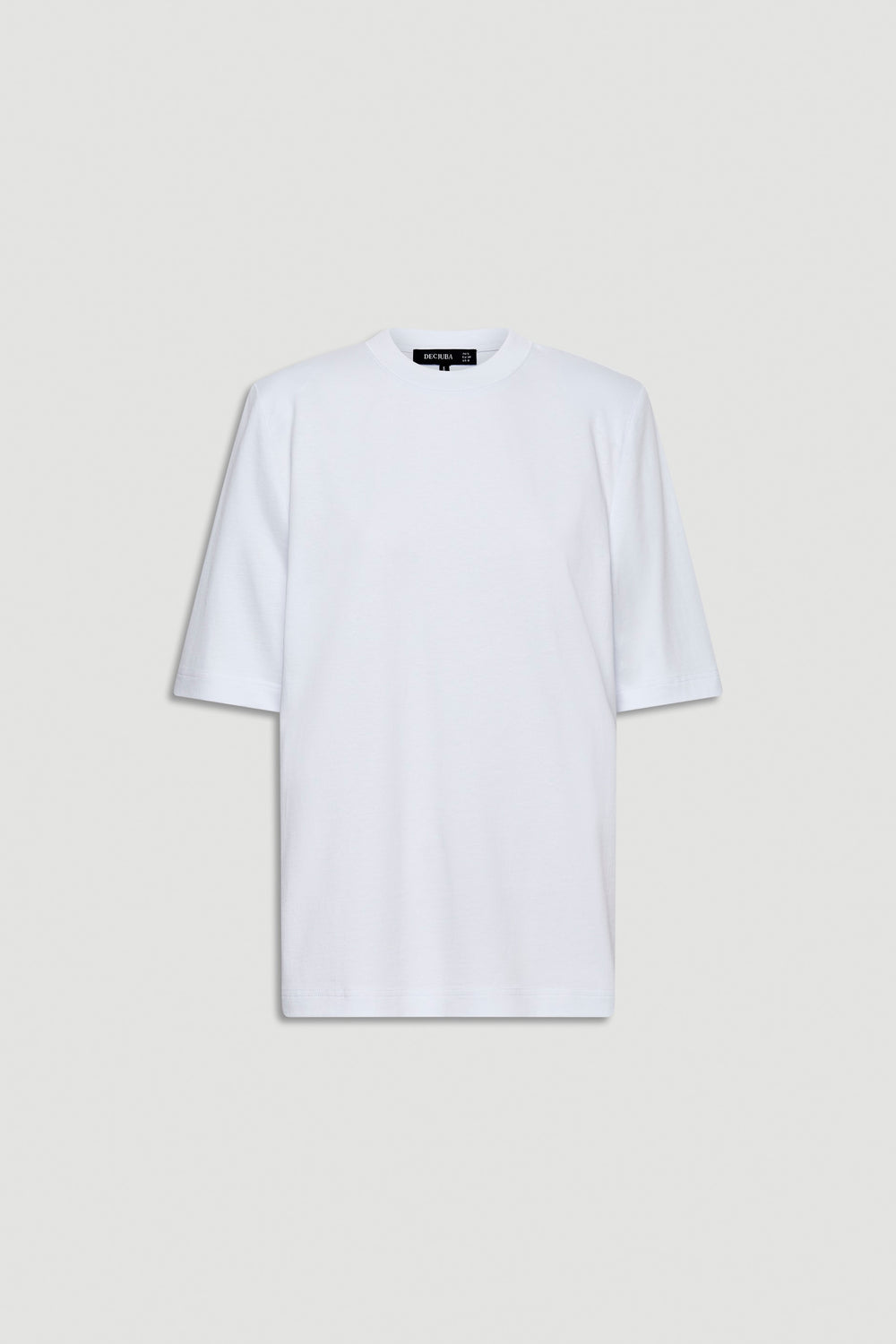 White tee featuring structured shoulder pads and a relaxed fit for an elevated everyday look.
