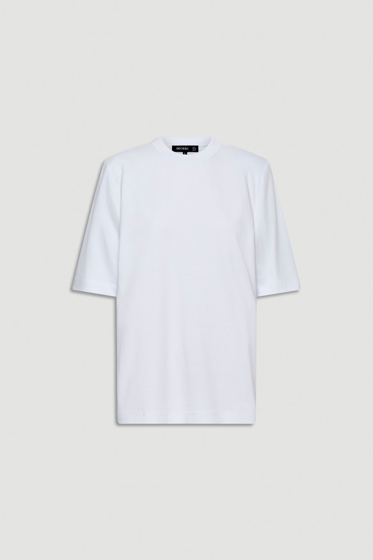 White tee featuring structured shoulder pads and a relaxed fit for an elevated everyday look.