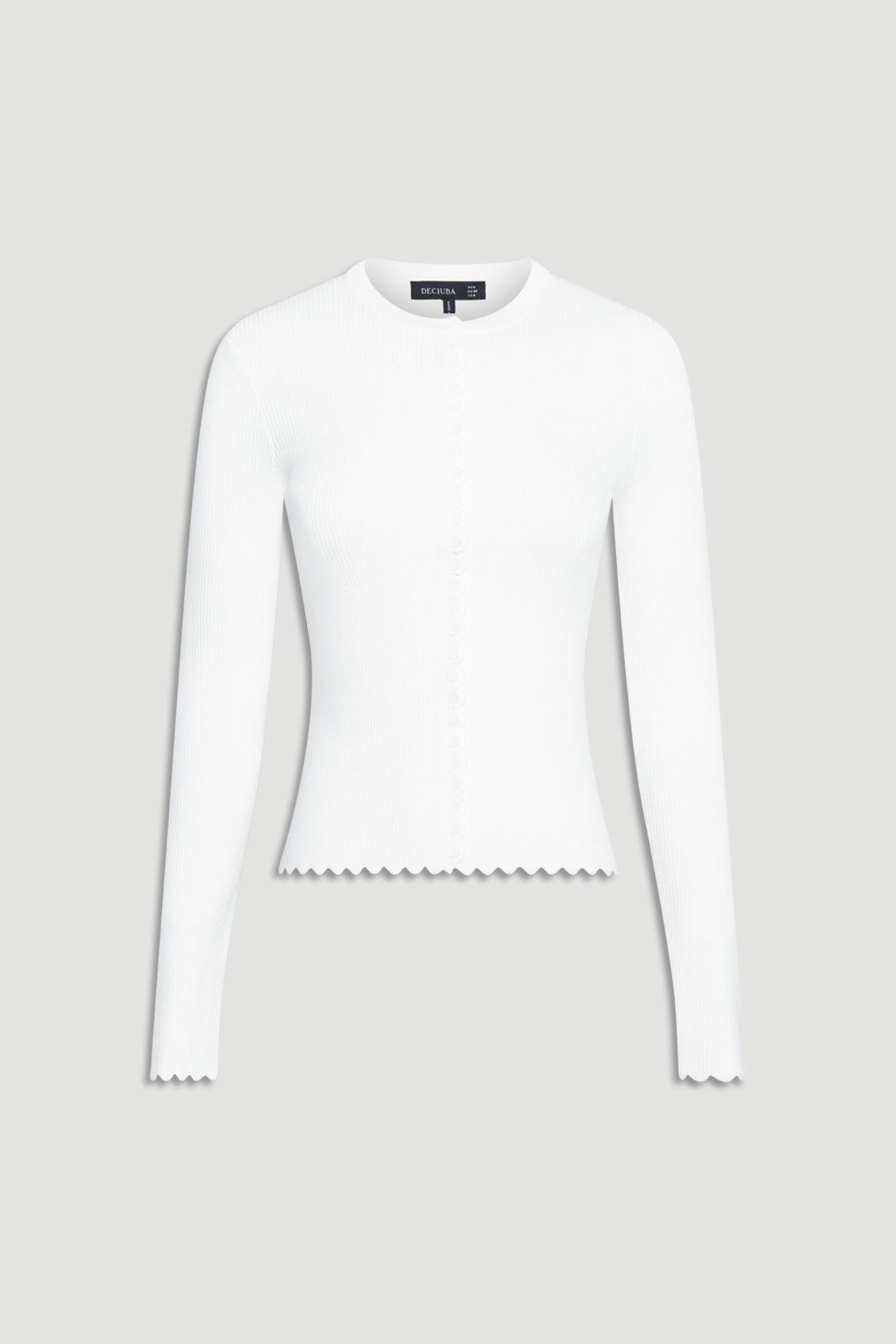 White fitted long-sleeve top featuring subtle scalloped edges on cuffs and hem with delicate button detailing down the front