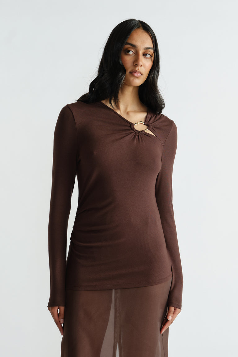 Slim-fit brown long sleeve top with gathered metal ring detail at neckline for a modern, stylish finish