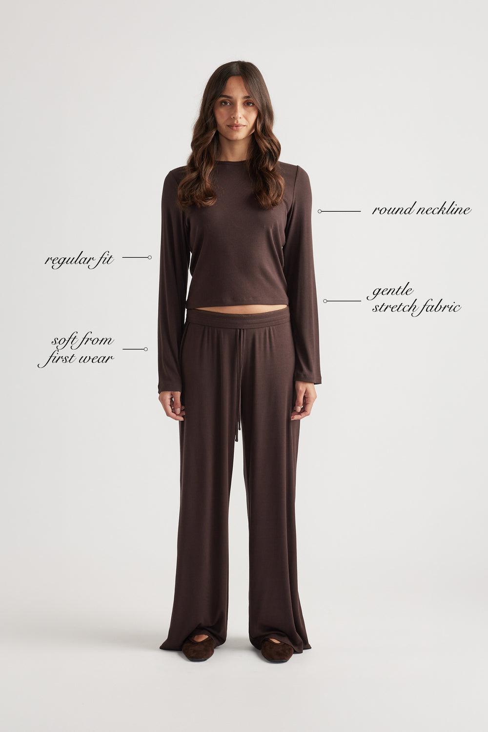 Woman wearing soft chocolate brown sleep top with ribbed texture and comfortable wide leg pants for relaxed fit style