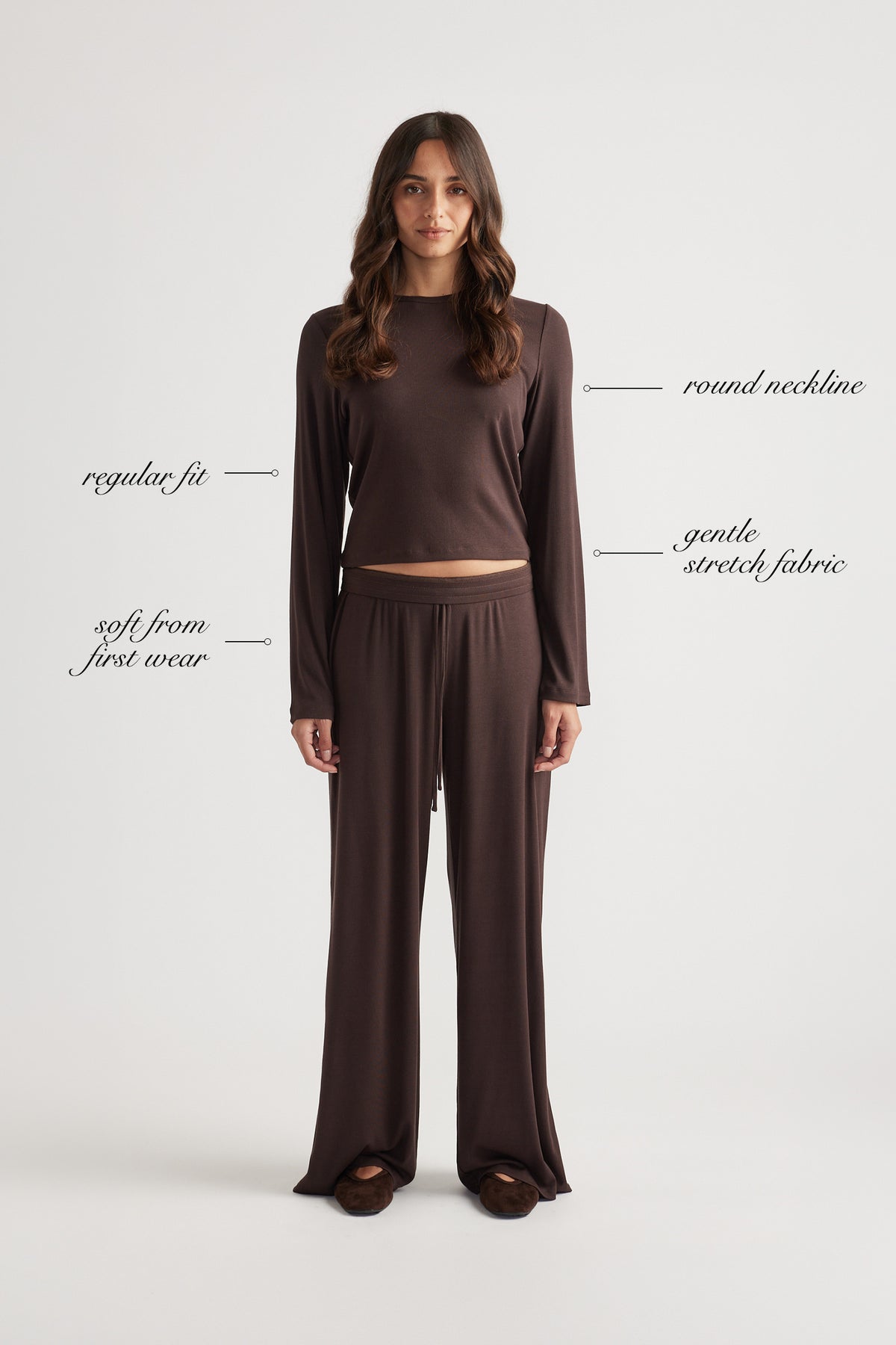 Woman wearing soft chocolate brown sleep top with ribbed texture and comfortable wide leg pants for relaxed fit style