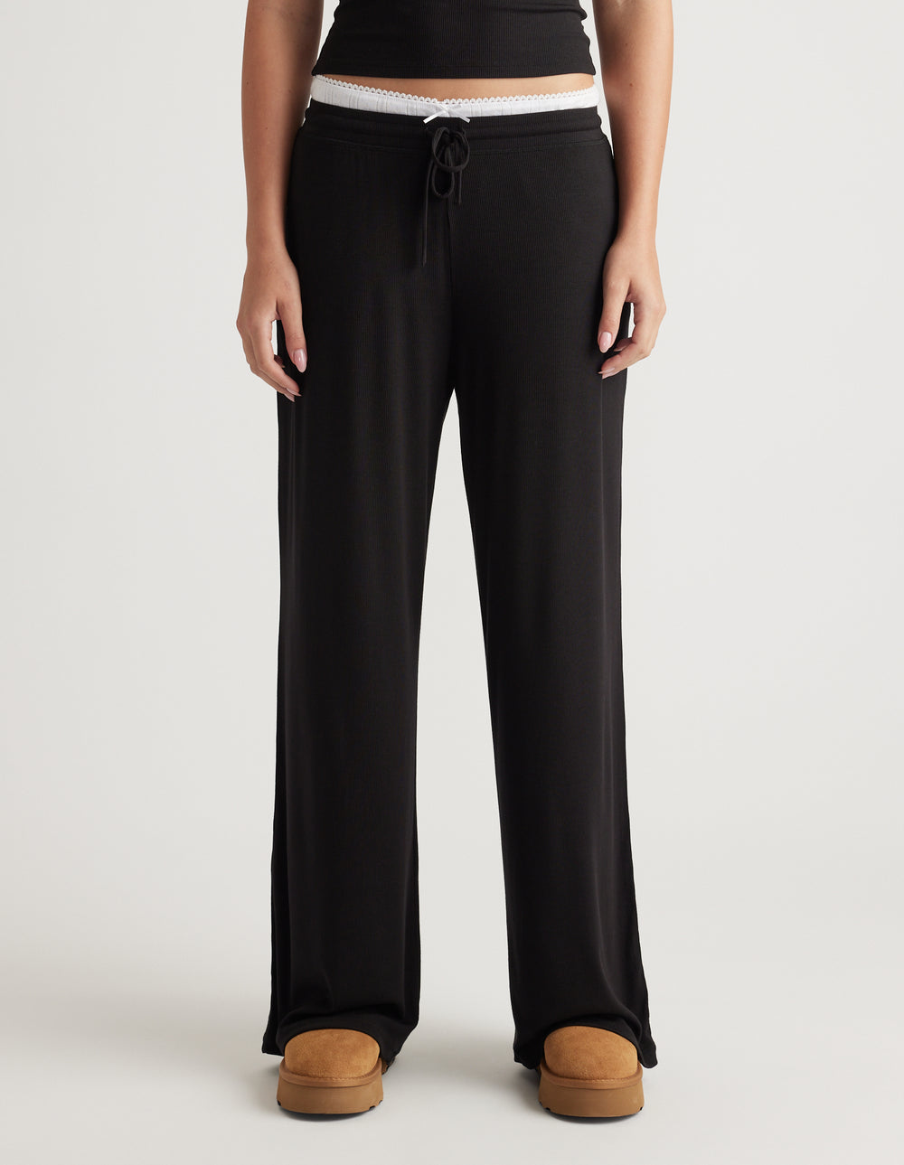 Black wide leg lounge pants with ribbed texture and adjustable drawstring at waist for relaxed everyday comfort