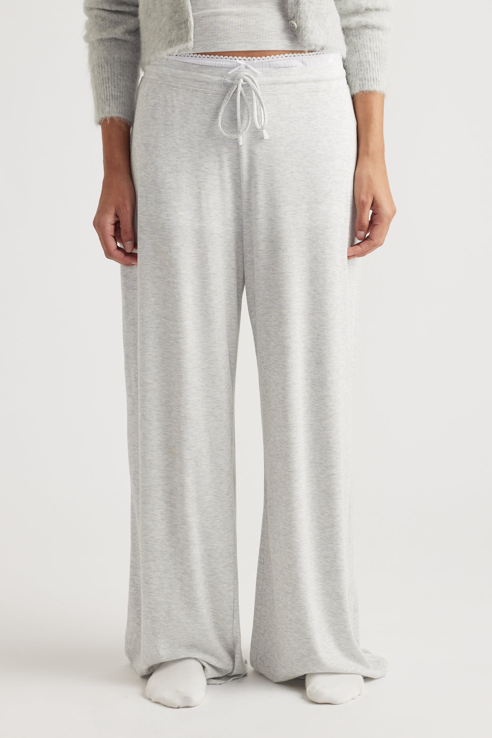Light grey ribbed wide leg pants with a drawstring waist and soft fabric for relaxed loungewear comfort