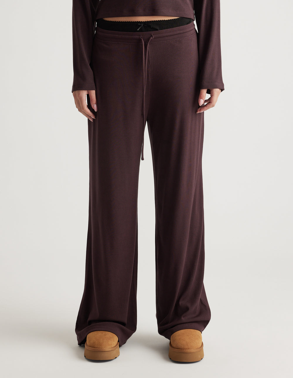 Soft ribbed wide leg pants in deep brown with drawstring waist and relaxed comfortable fit for everyday wear