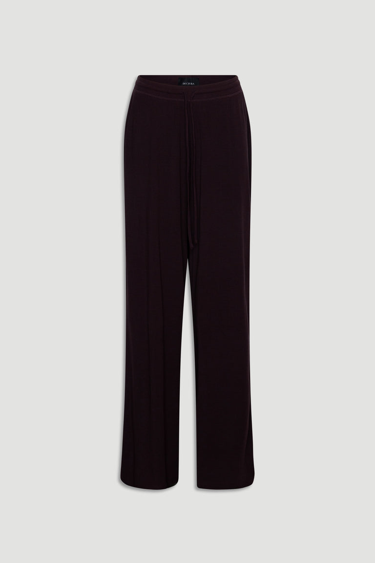 Soft ribbed wide leg pants in deep rhubarb color with an elasticated waistband and drawstring detail for relaxed comfort