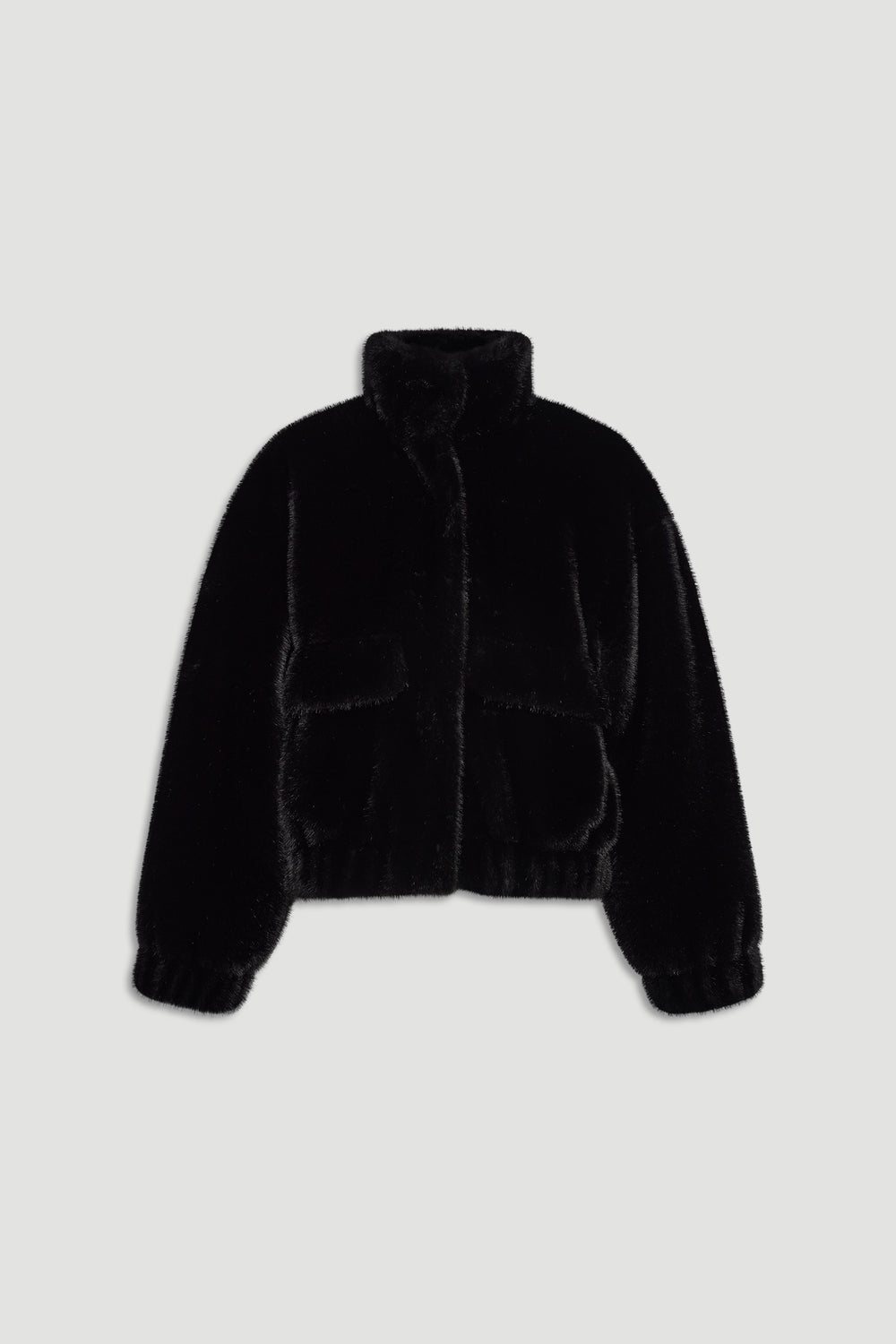 Black faux fur bomber jacket with a high collar, elastic cuffs, and front patch pockets, perfect for cozy layering.