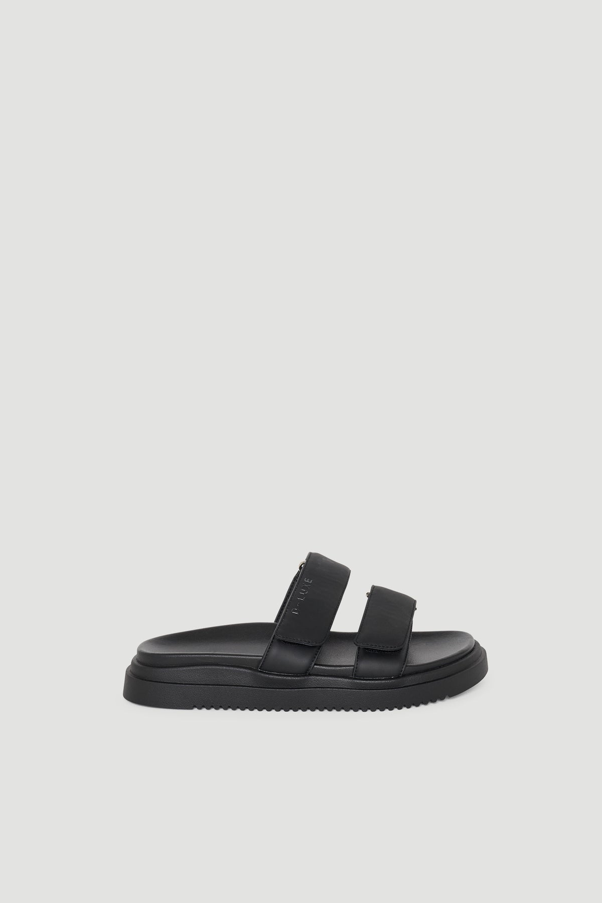 Black slip-on slide sandal with two wide adjustable straps and a cushioned sole for everyday comfort