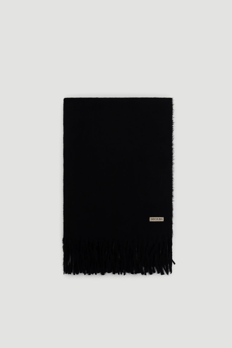 Black soft scarf with subtle fringe detailing and a small branded tag near the edge for a sleek finish