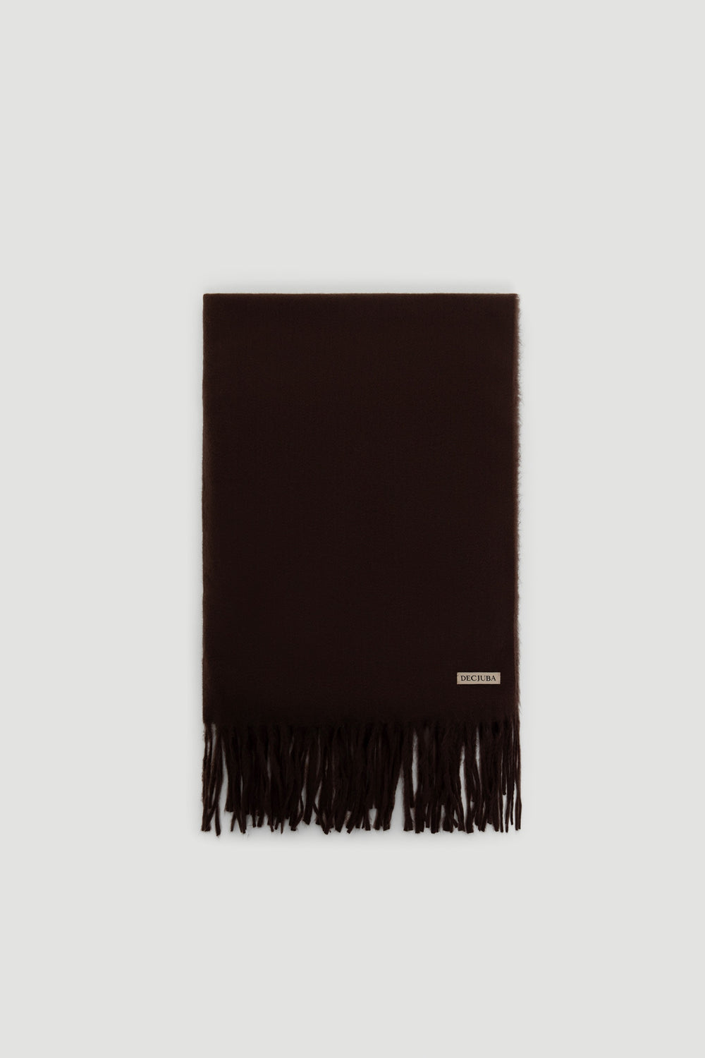 Dark chocolate solid scarf with soft texture and fringed ends, featuring a small branded label near the edge