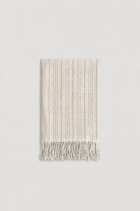 Light beige check patterned scarf with soft texture and delicate fringe edges for a cozy, stylish touch