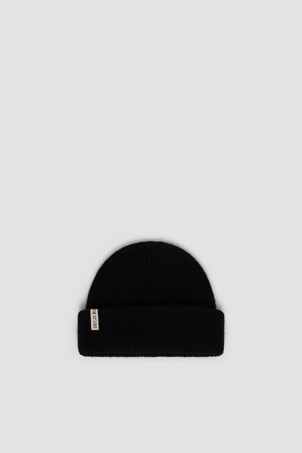 Black ribbed knit beanie with a folded cuff and subtle branded tag for everyday versatile style.