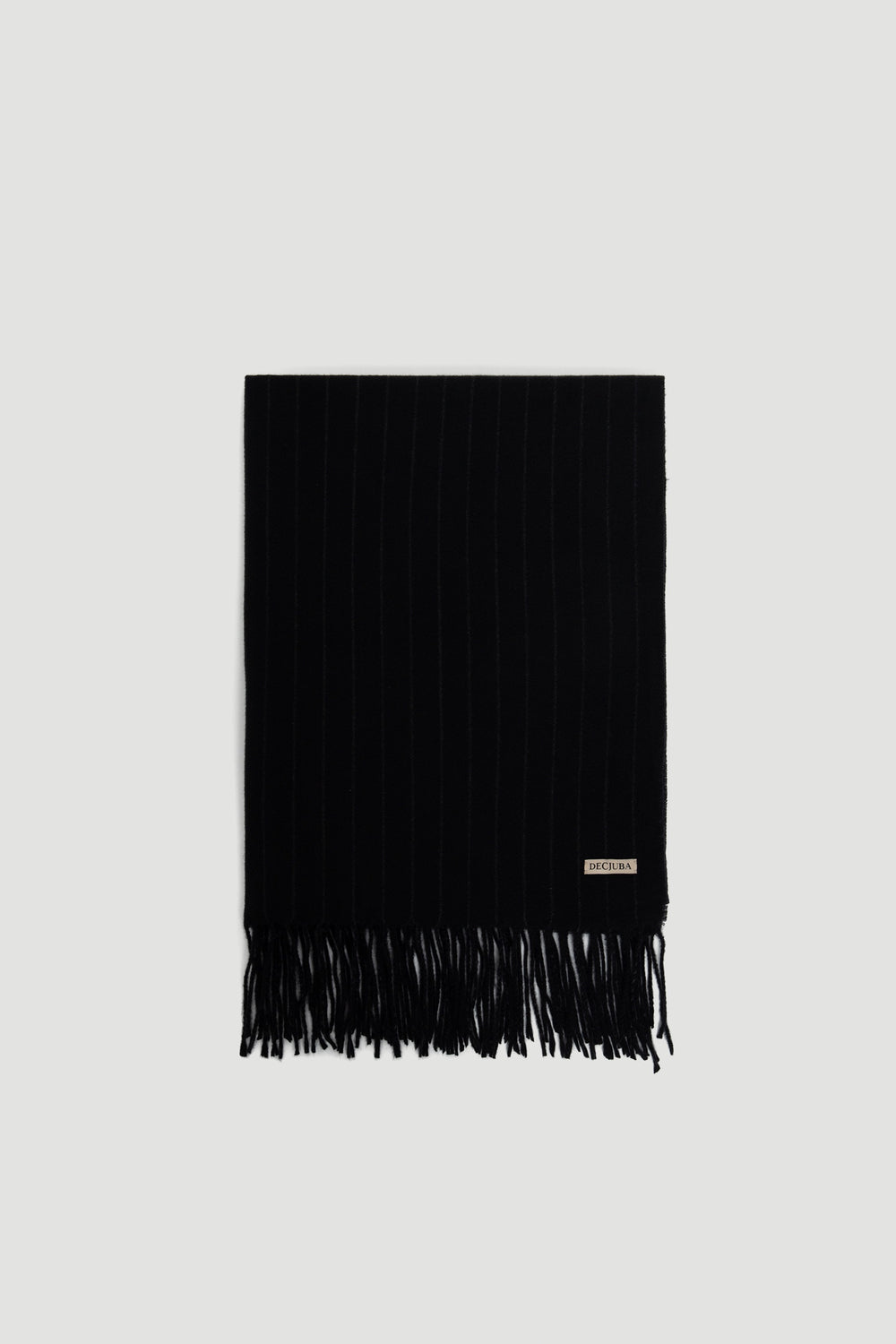Gia Stripe Scarf in deep charcoal with subtle pinstripes and fringe trim, featuring a small DECJUBA logo patch.