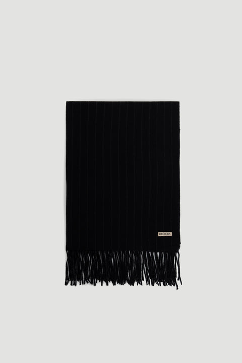 Gia Stripe Scarf in deep charcoal with subtle pinstripes and fringe trim, featuring a small DECJUBA logo patch.