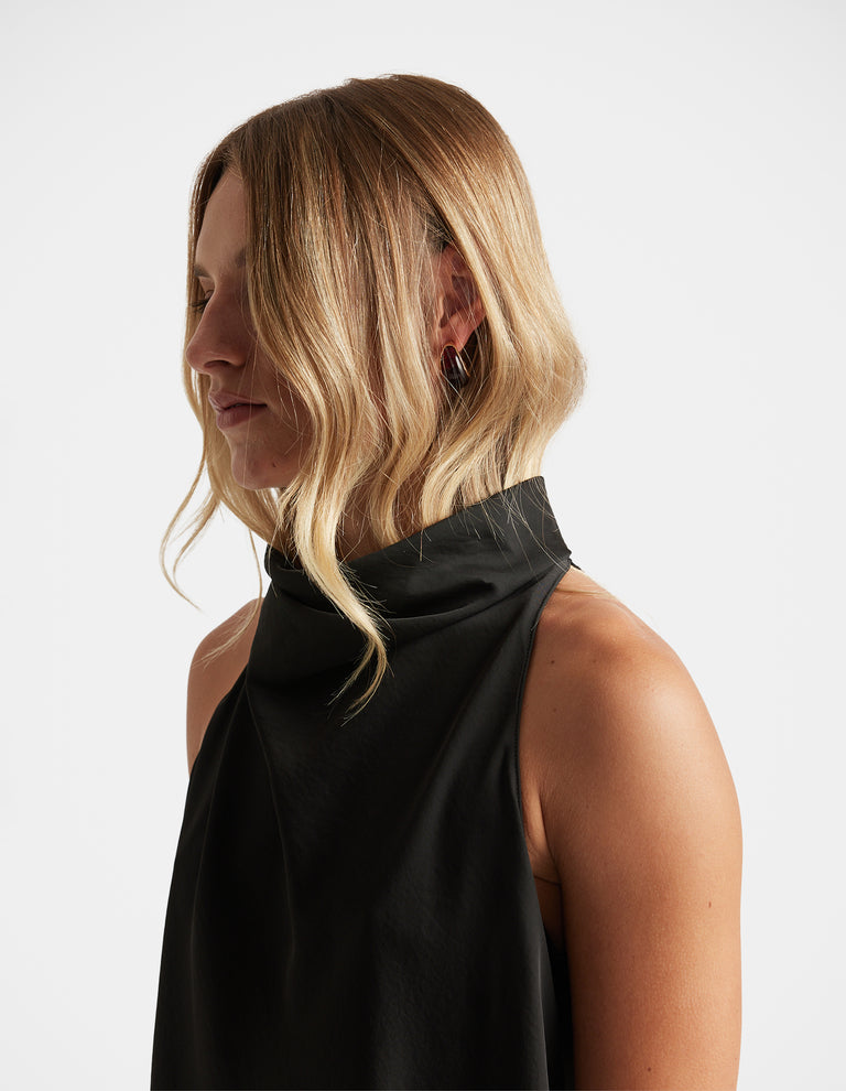 Side view of woman wearing Mila 3 Pack Earrings in dark hoops styled with a sleeveless black top by DECJUBA Australian brand