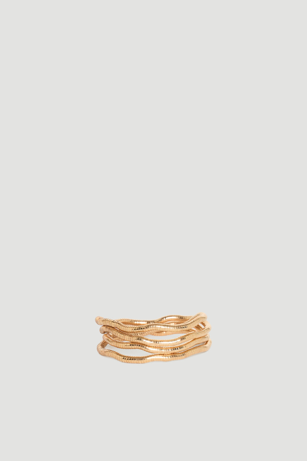 Maya Wrap Bracelet in polished gold-tone with layered wavy design, effortlessly stylish by DECJUBA Australian fashion brand