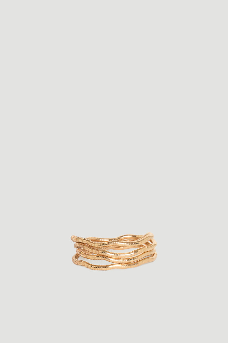 Maya Wrap Bracelet in polished gold-tone with layered wavy design, effortlessly stylish by DECJUBA Australian fashion brand