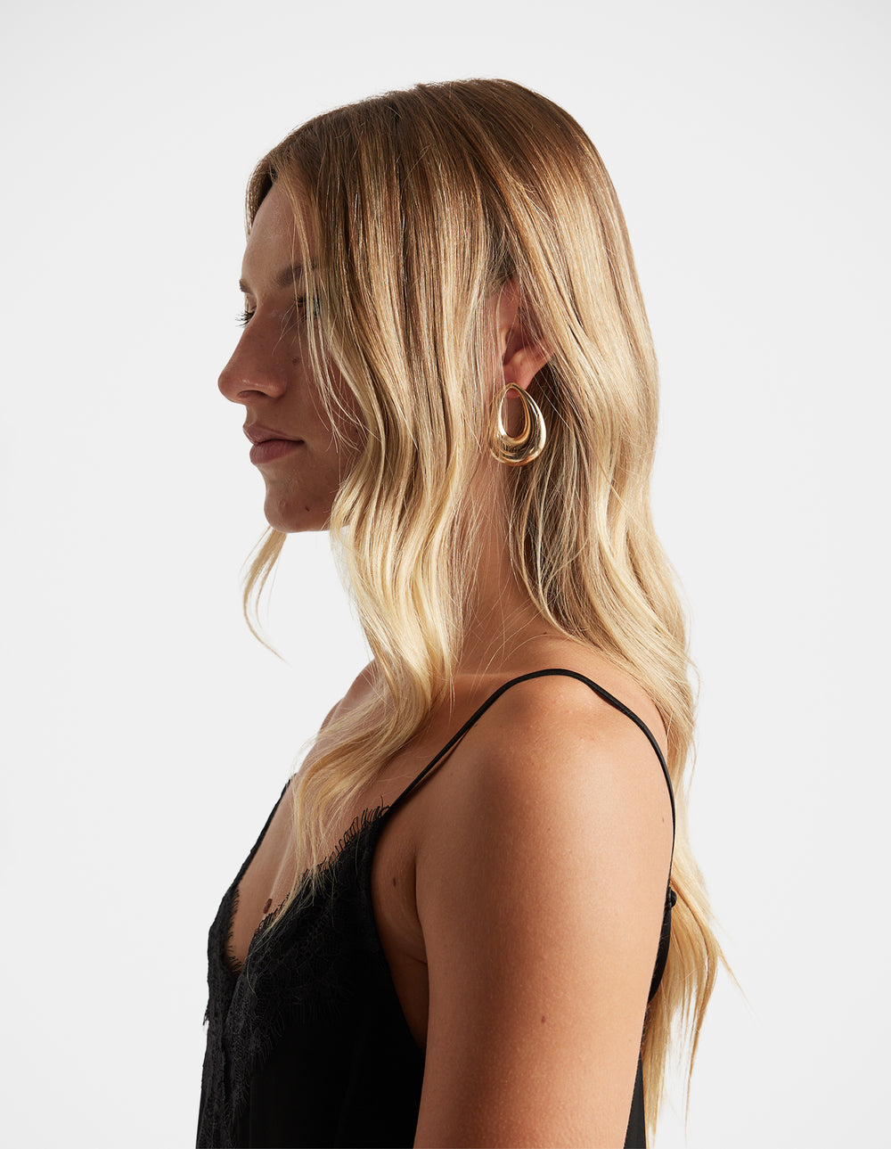 Margot Statement Earrings in polished gold-tone with elegant sculptural loops by DECJUBA Australian fashion brand