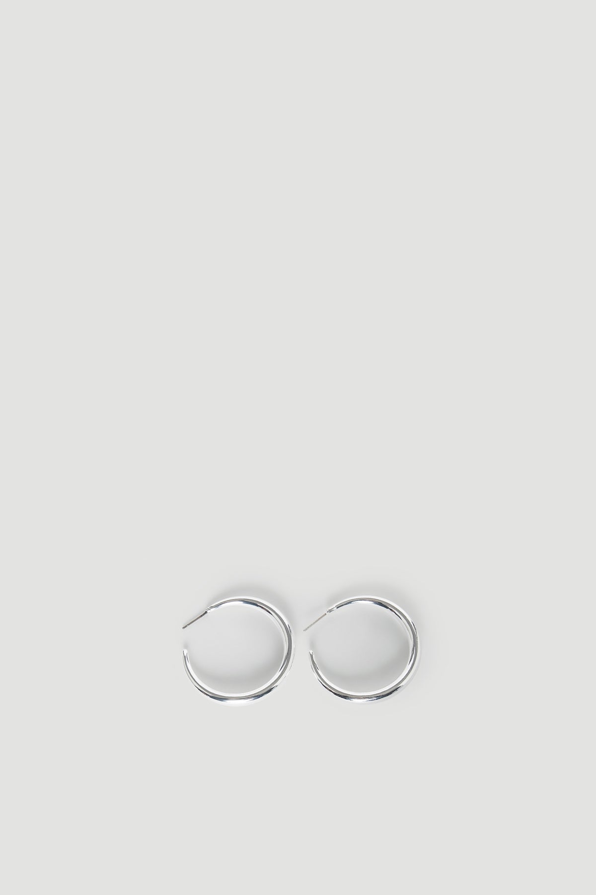 Ellie Classic Hoop Earrings in polished silver with a smooth, rounded design for timeless elegance by DECJUBA