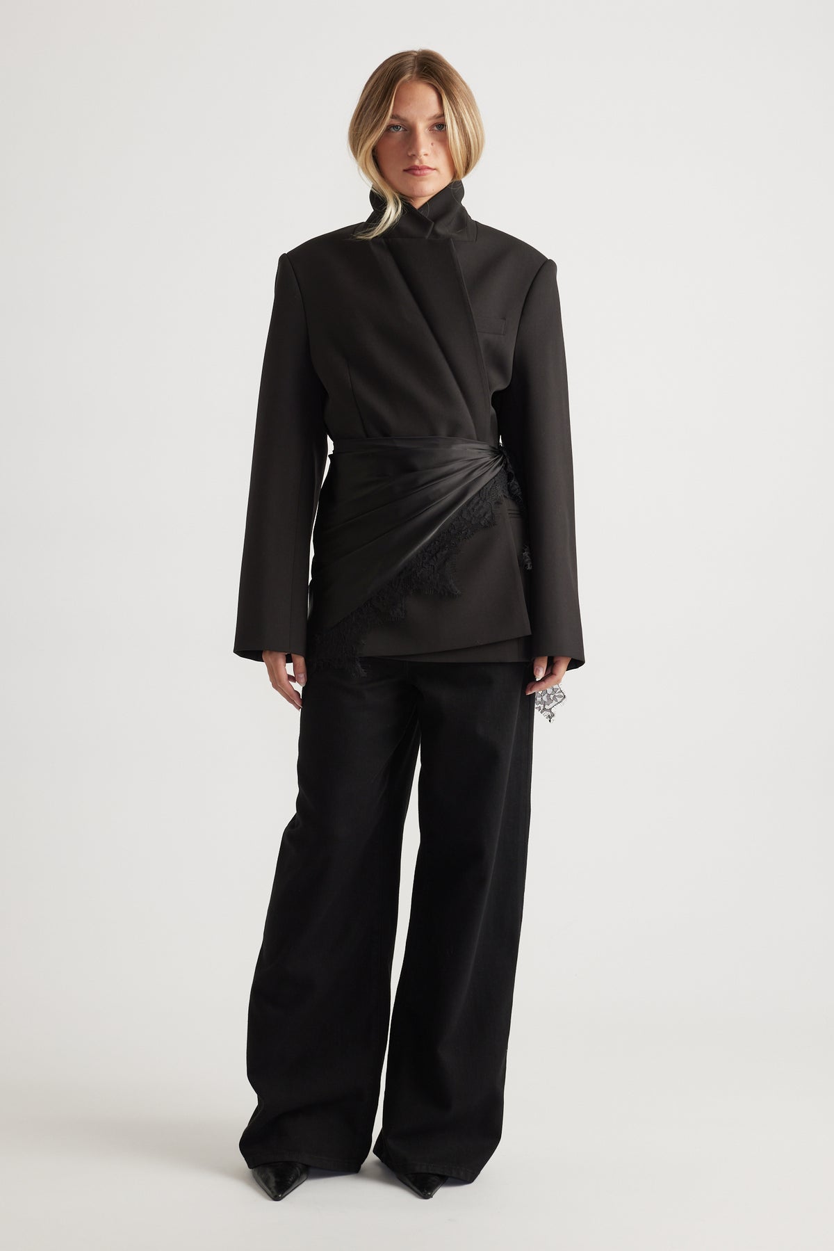 Woman wearing black tailored blazer and wide-leg pants styled with layered Sienna Lace Scarf by DECJUBA.