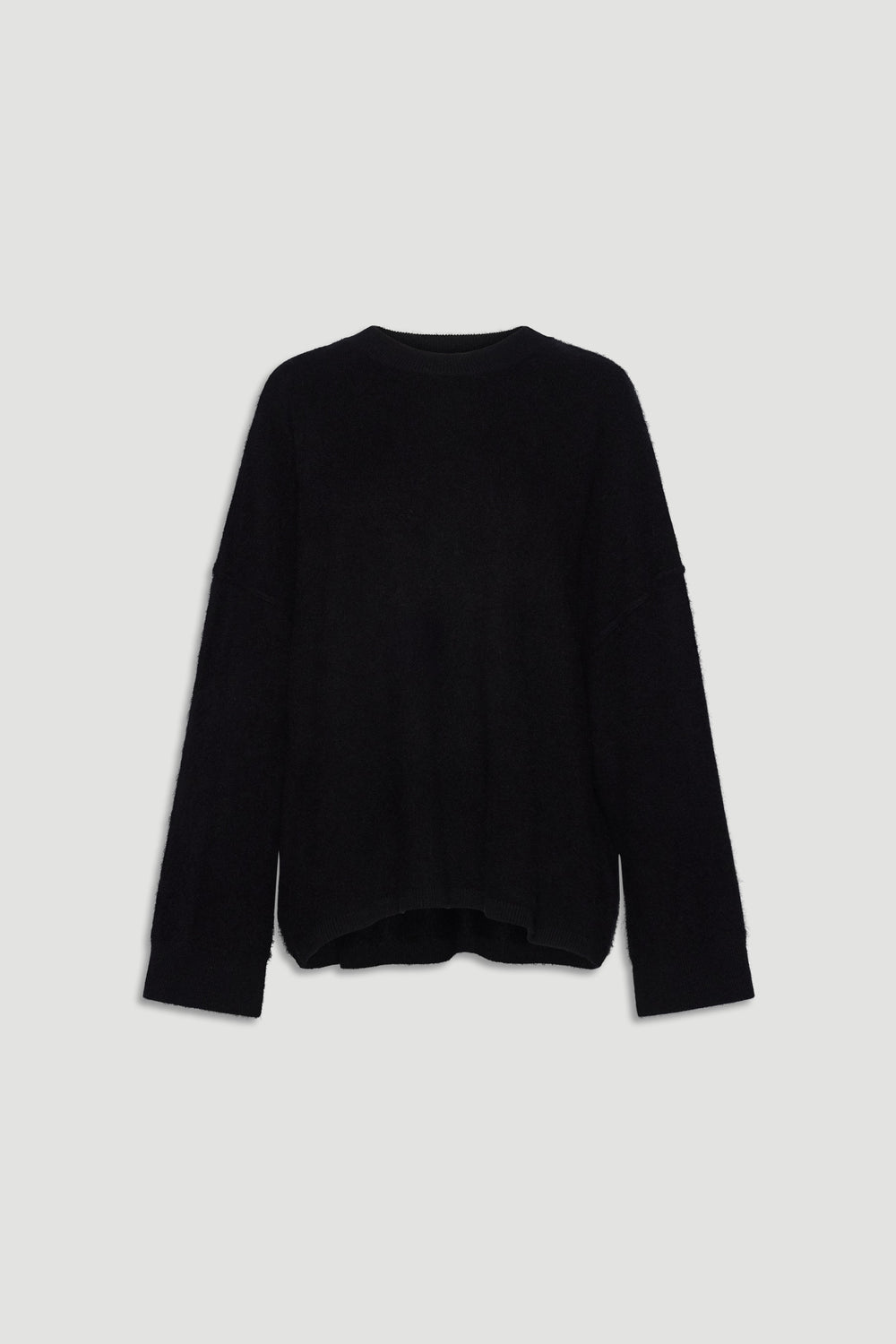 Black oversized wool knit sweater with relaxed fit and long sleeves for cozy, stylish layering.