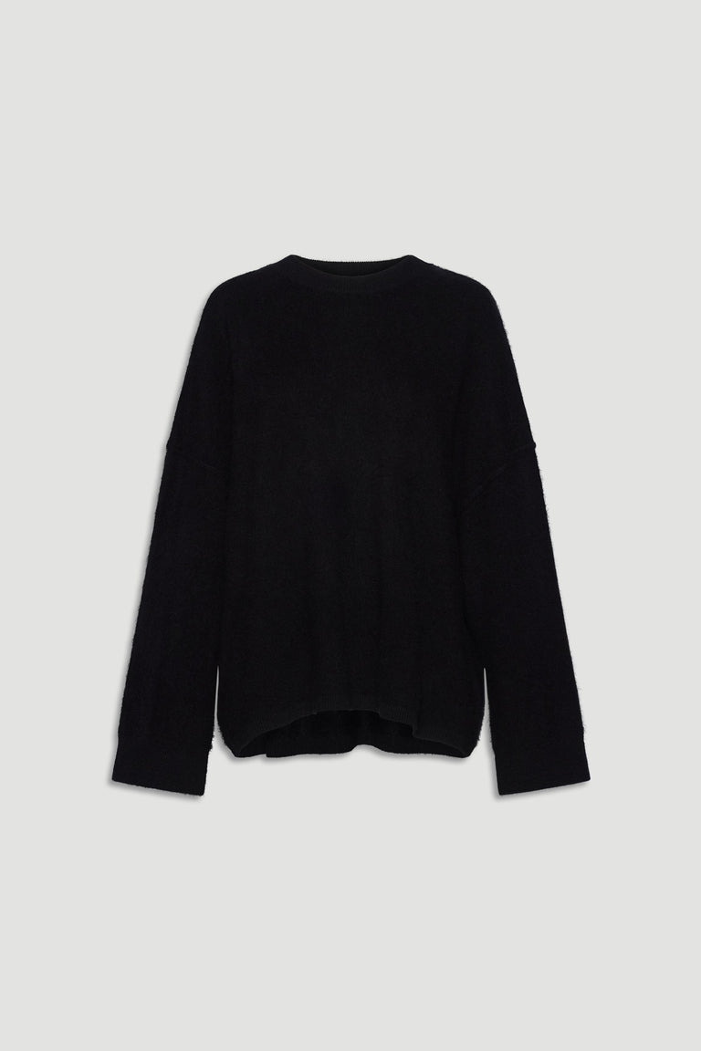Black oversized wool knit sweater with relaxed fit and long sleeves for cozy, stylish layering.