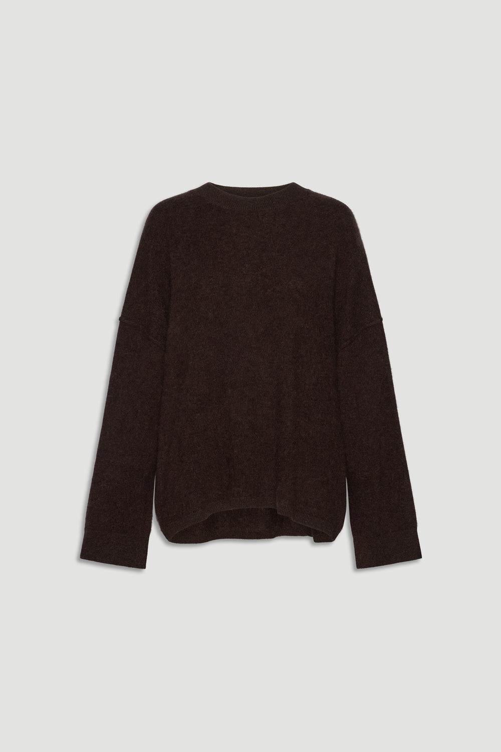 Cozy oversized dark brown wool knit sweater with relaxed fit and long sleeves for effortless everyday comfort.
