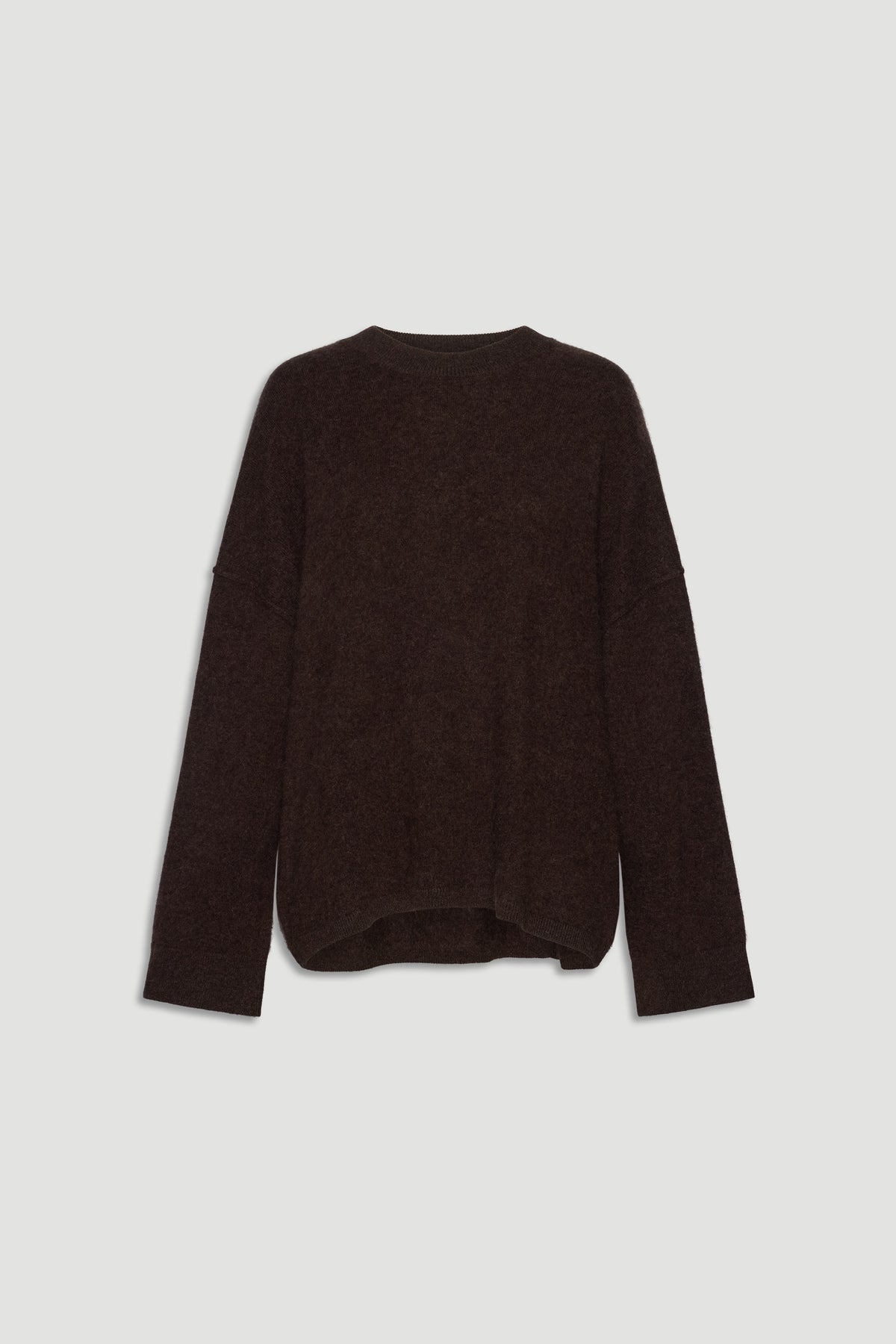 Cozy oversized dark brown wool knit sweater with relaxed fit and long sleeves for effortless everyday comfort.