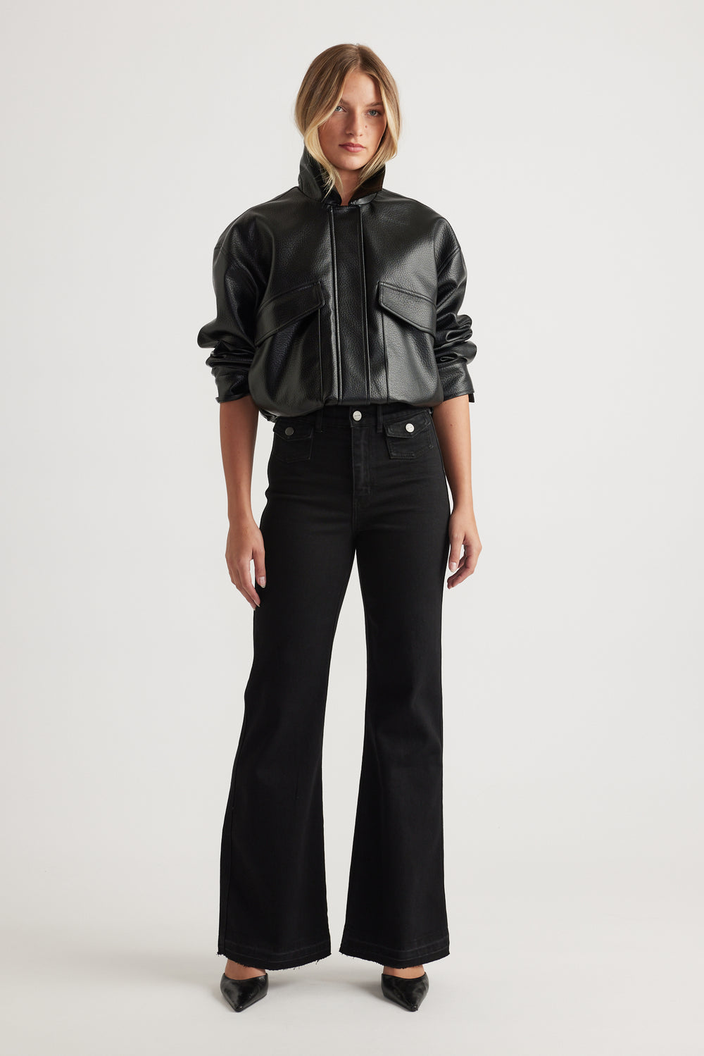 Bea Flare Jean in black denim with a high-rise waist and flared legs styled with a black leather jacket by DECJUBA Australian brand