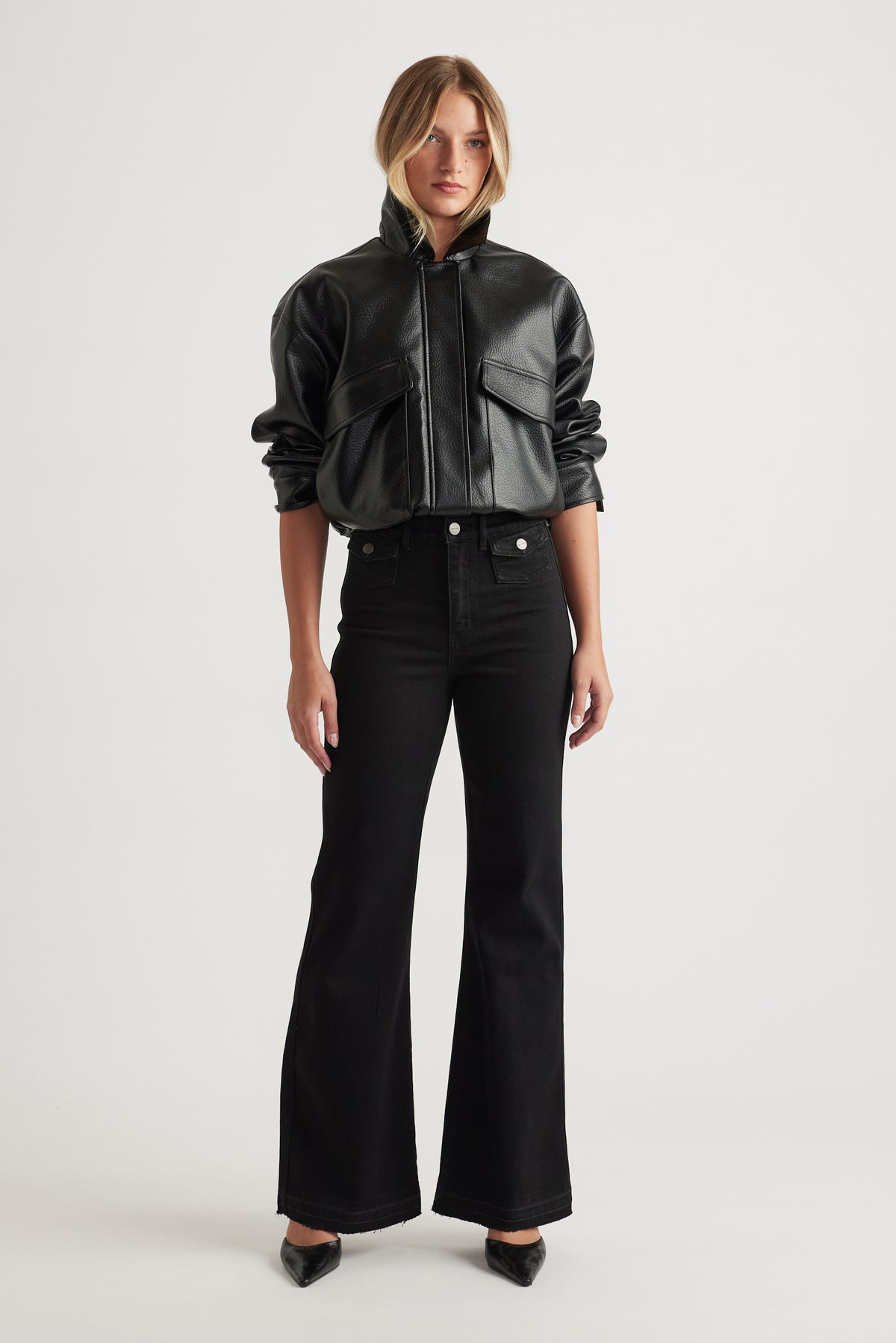 Bea Flare Jean in black denim with a high-rise waist and flared legs styled with a black leather jacket by DECJUBA Australian brand