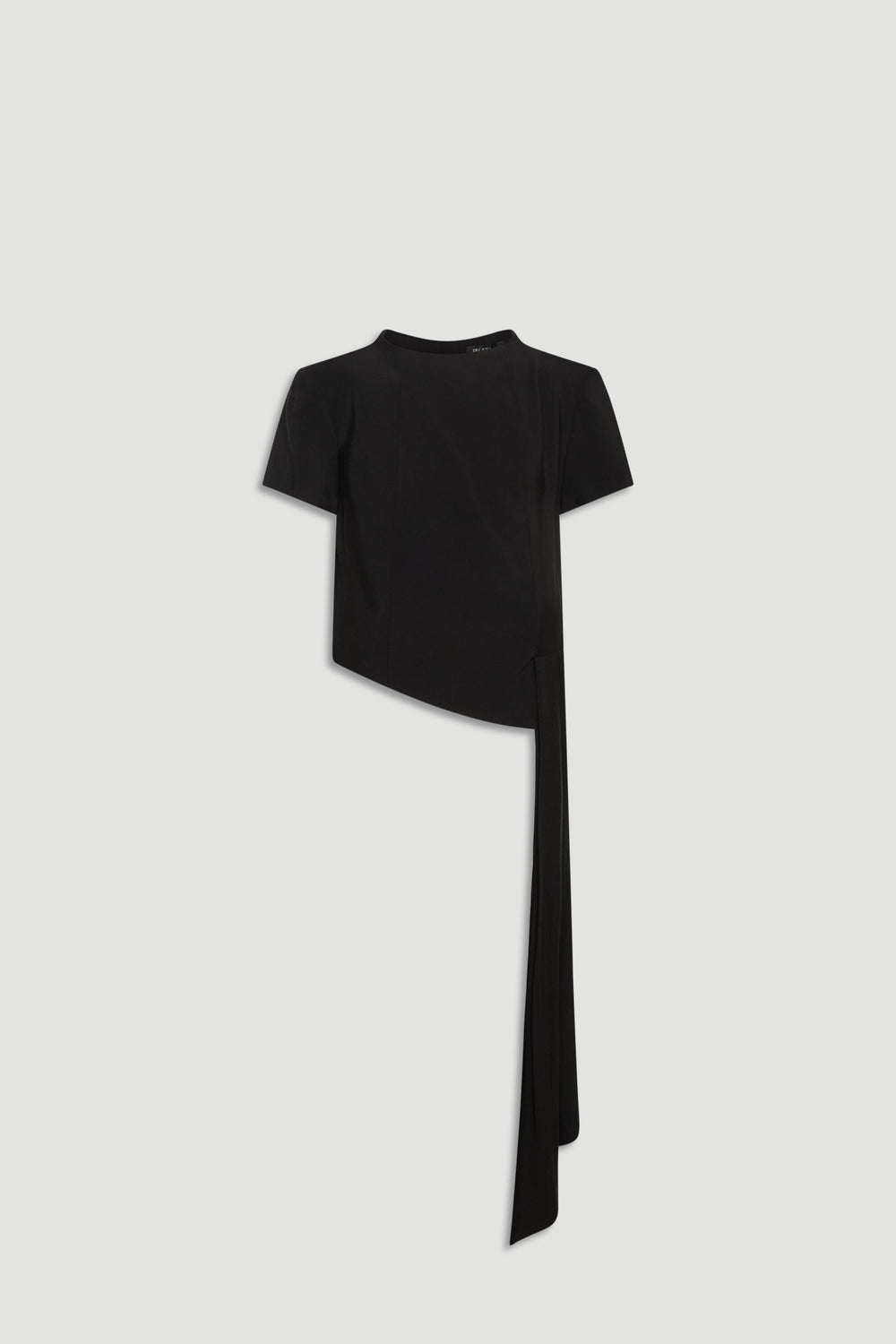 Black short sleeve top with asymmetric hem and long draped detail for a modern, elegant look.