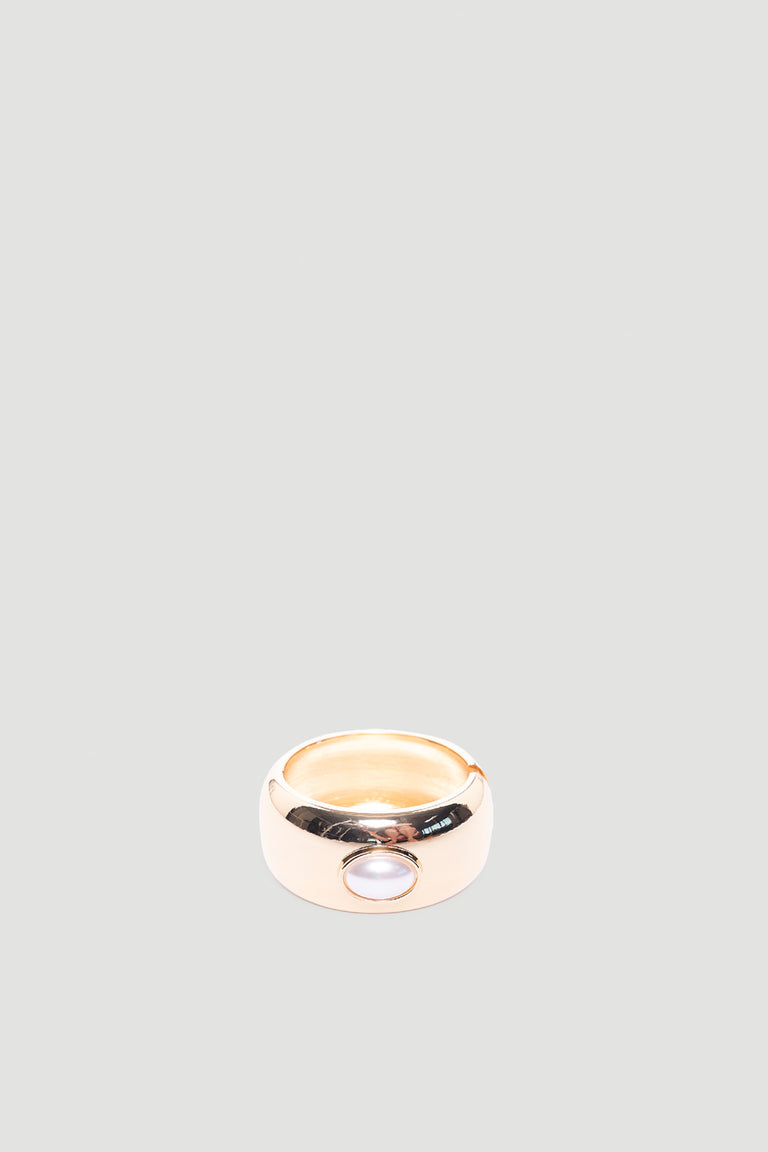 Monica Stone Cuff Bracelet in polished gold tone with single pearl detail for a refined, versatile accessory by DECJUBA