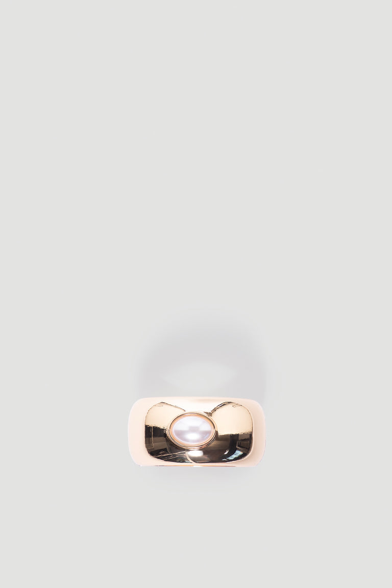 Monica Stone Cuff Bracelet in polished gold tone featuring a central pearl detail for a timeless, elegant accessory by DECJUBA