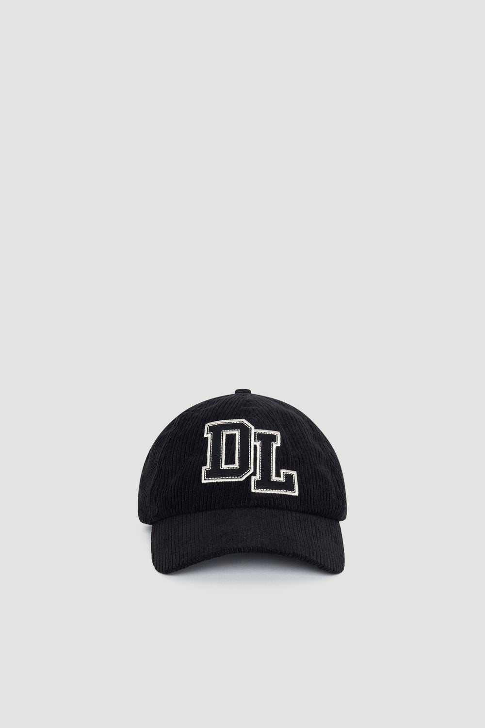 Black D-luxe Kim Cord Cap with textured cord fabric and contrasting embroidered "DL" logo for stylish everyday wear.