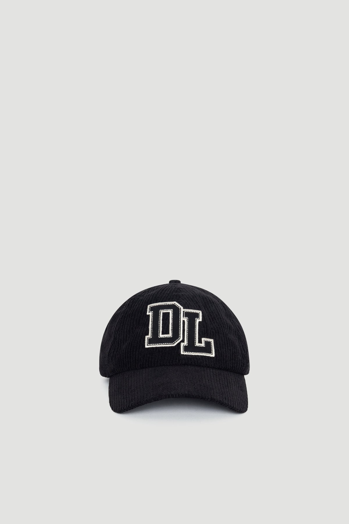 Black D-luxe Kim Cord Cap with textured cord fabric and contrasting embroidered "DL" logo for stylish everyday wear.
