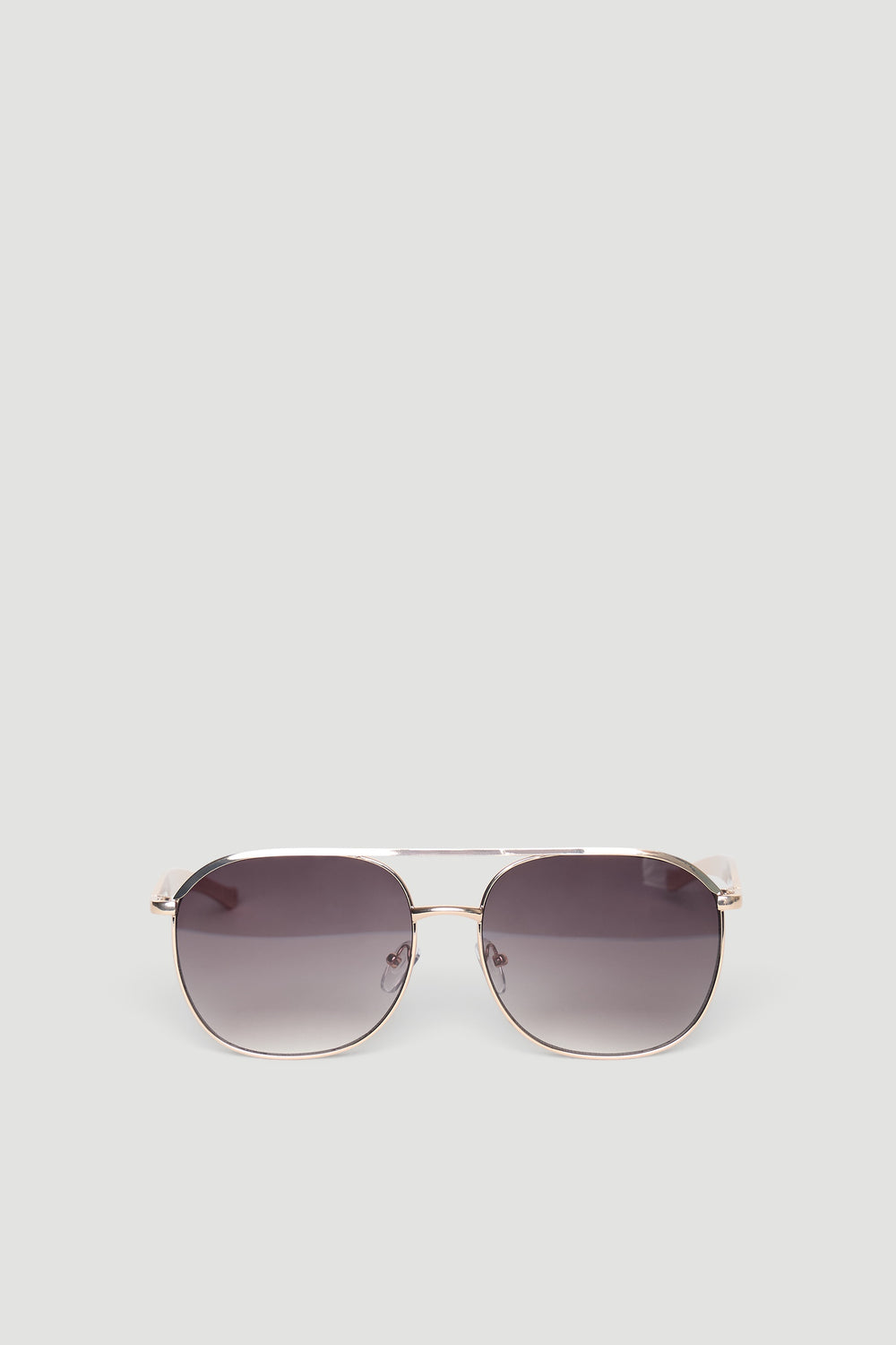 Sleek aviator sunglasses featuring gradient tinted lenses and a thin metallic frame in warm brown tones.